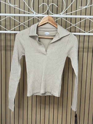 Camiseta polo canalé beige