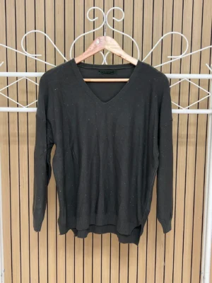 Jersey punto brillos manga larga escote pico verde