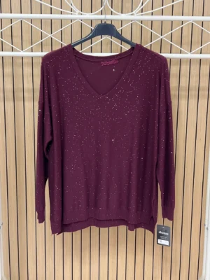 Jersey punto brillos manga larga escote pico berenjena