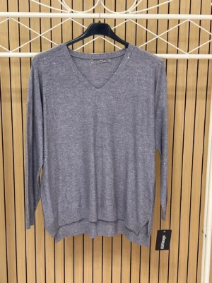 Jersey punto brillos manga larga escote pico gris